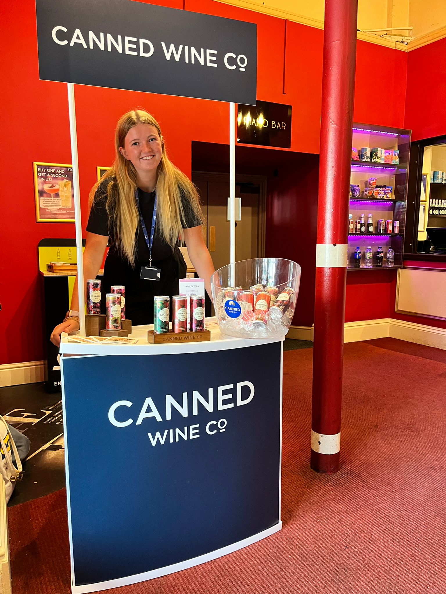 Milly running a sampling tasting event for Canned Wine Co. at ATG Theatres