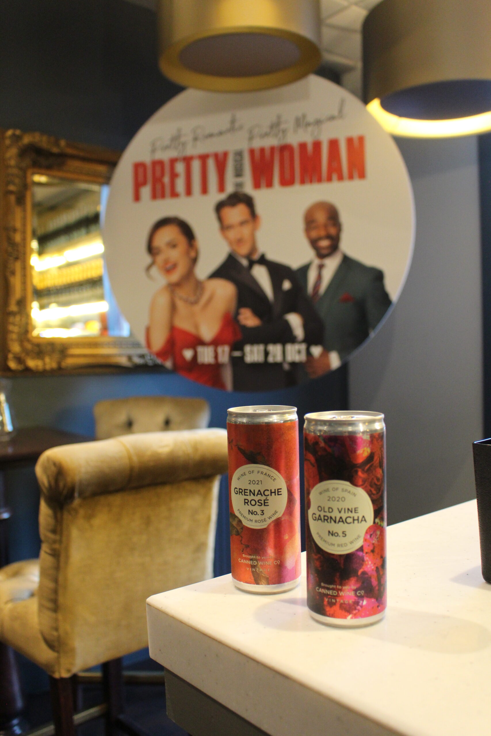 Canned Wine Co. Grenache Rose and Old Vine Garnacha on a table at ATG Theatre showing Pretty Woman