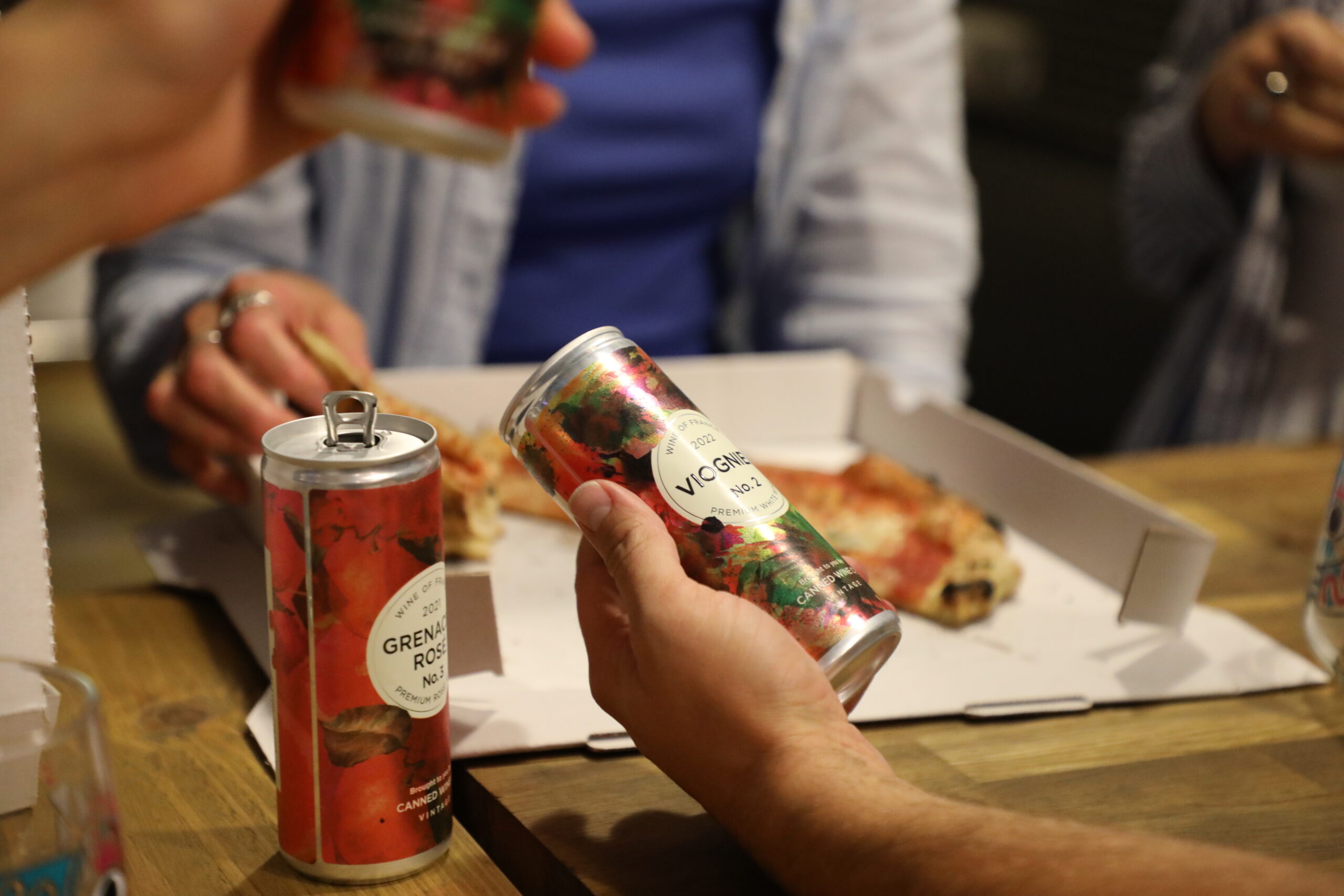 A can of Viognier and pizza at the Electric Bear Brewery tap room.