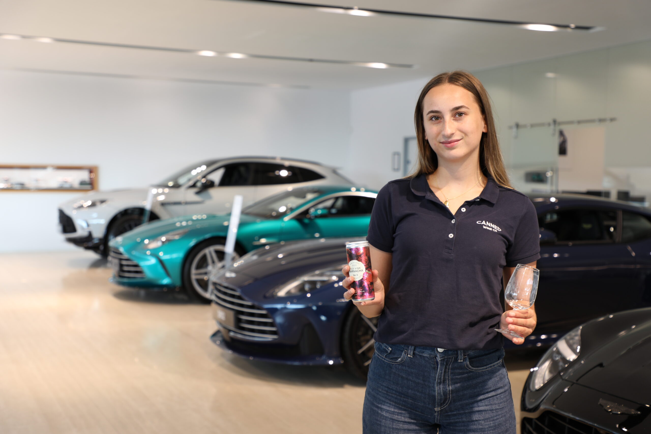 Lauren shares Canned Wine Co. with guests at Aston Martin in Bristol.