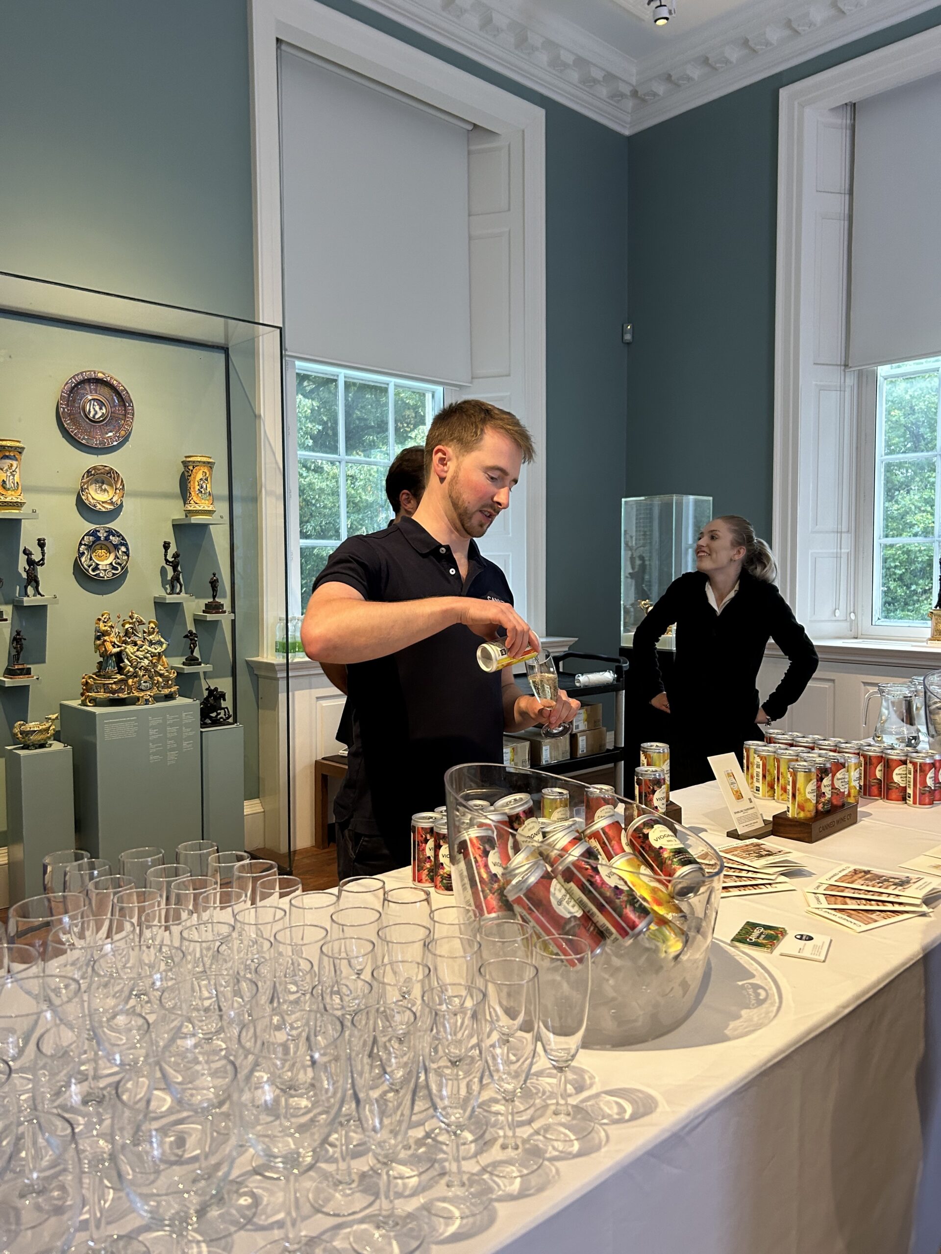 Pouring cans of wine at the Holburne private viewing exhibition