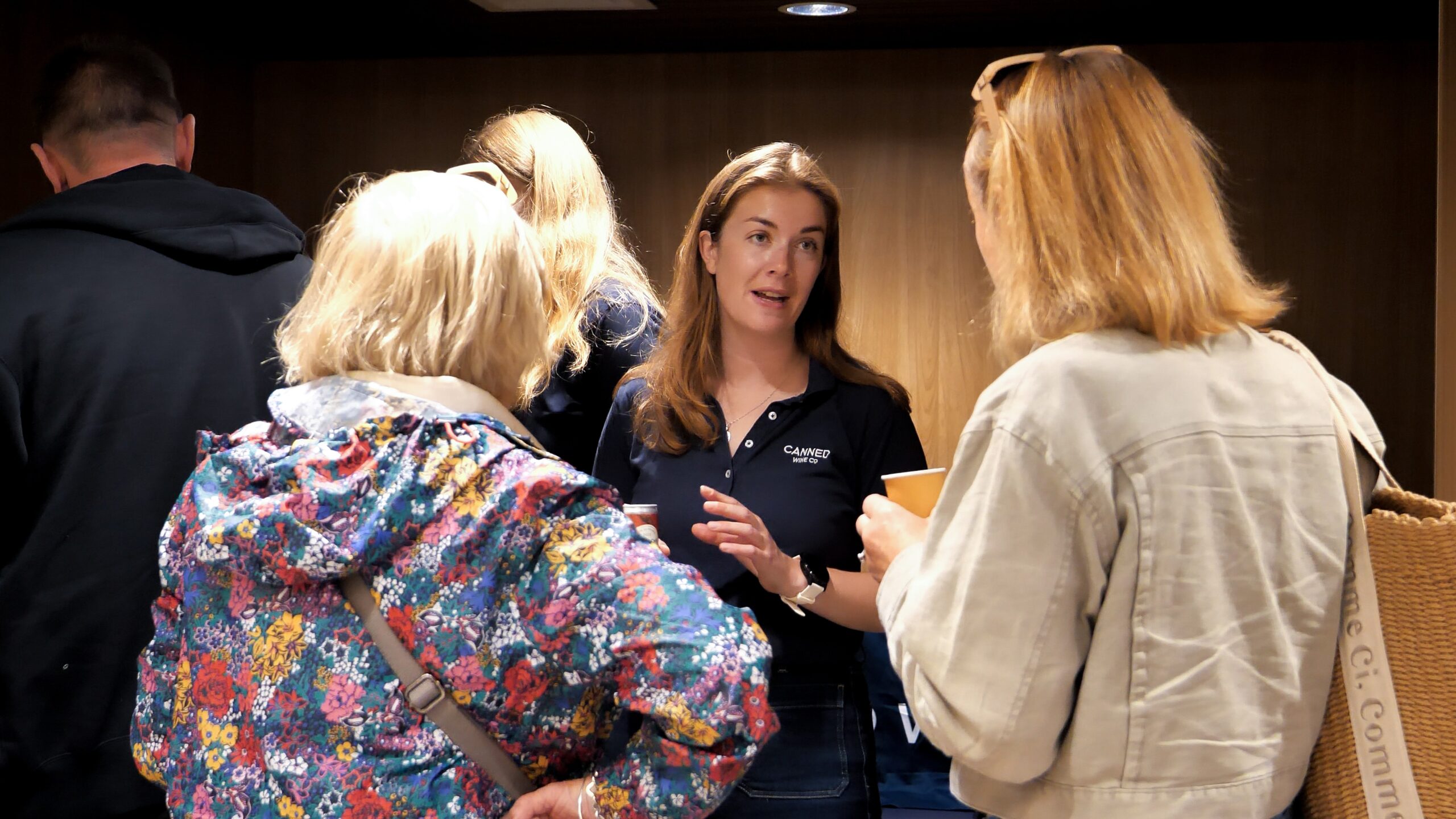 Abi shows customers at CalMac our range of Canned Wine Co.